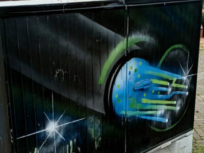 Glowing circuit on a night ground — Street art in Erkrath