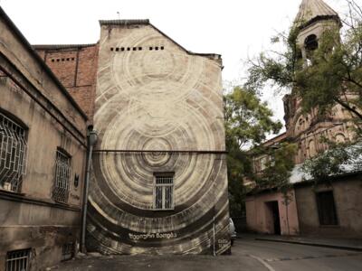 Solar Logos — Street art by Faith47 in Tbilisi