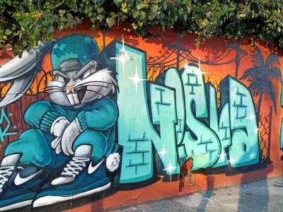 Tracksuit rabbit and turquoise lettering — Street art in Nantes