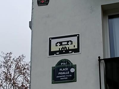 Cream Space Invader on Place Pigalle — Street art by Invader in Paris
