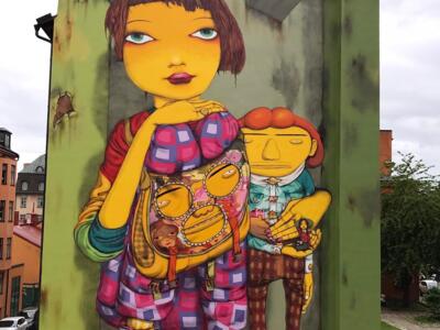 The yellow girl of Mosebacke — Street art by Osgemeos in Stockholm