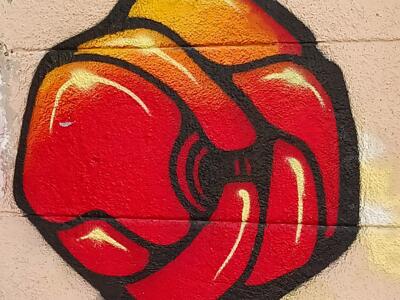 Red and orange form outlined in black — Street art in Marseille