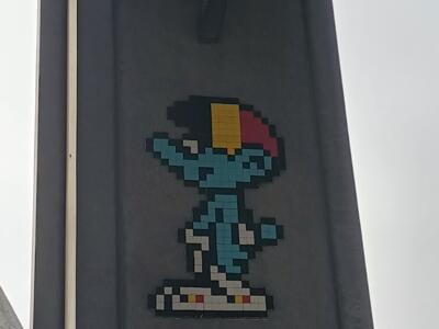 Smurf with a Belgian Tricolour Cap — Street art by Mifamosa in Bruxelles