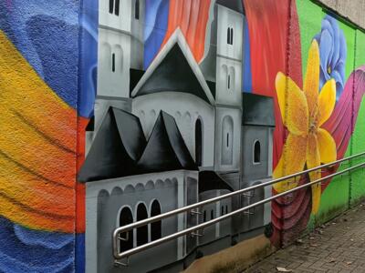 Erkrath church with coloured ribbons — Street art by NEANDERARTgroup in Erkrath