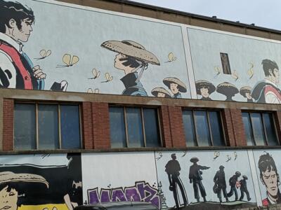 Corto Maltese and the straw hats — Street art by Hugo Pratt in Bruxelles