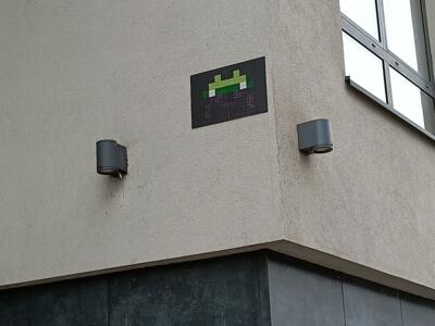Green and Purple Space Invader — Street art by Invader in Bruxelles