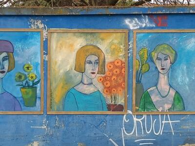Three framed flower-crowned women — Street art in Lisboa