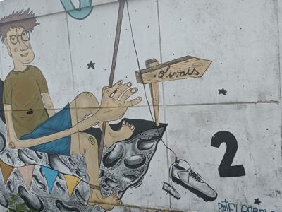 Man Sitting on a Crescent Moon — Street art in Lisboa