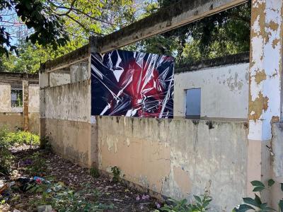 Tormented Red and Black Face — Street art by Madjer Linares in San Vicente