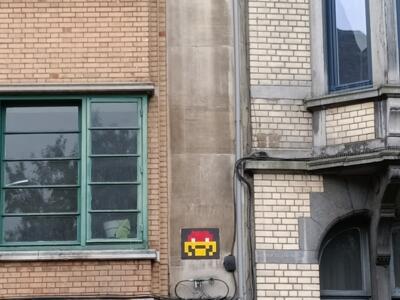 Red and Yellow Space Invader — Street art by Invader in Saint-Gilles