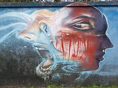 Two profiles, the pale and the red — Street art in Lisboa