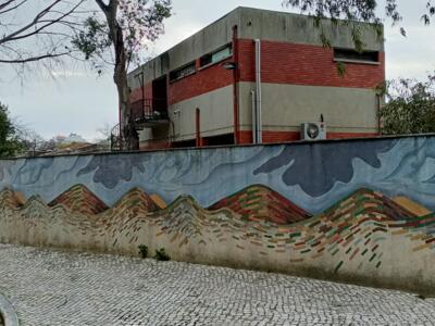 Mountains painted in bands of colour — Street art by Mariana Rio in Lisboa