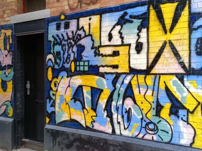 Blue and Yellow Painted Wall on Rue de Flandre — Street art in Bruxelles