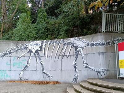 Bipedal dinosaur skeleton — Street art by Bonom in Ixelles