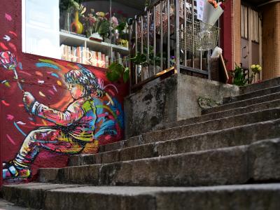 Child with Crane — Street art by Alice Pasquini in Hong Kong