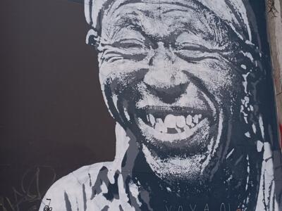 The Laughing Old Man in a Turban — Street art in Bruxelles