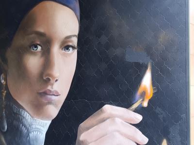 The Woman with the Match — Street art in Berlin