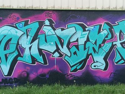 Lettrage turquoise du crew MGD — Street art à Sainte-Luce-sur-Loire