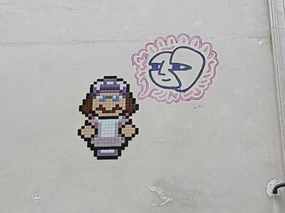 Personnage en mosaïque au bonnet mauve — Street art de IN THE WOUP à Paris