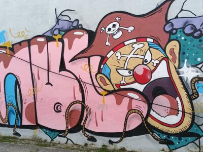 Pink Lettering and Pirate Clown — Street art in Almada
