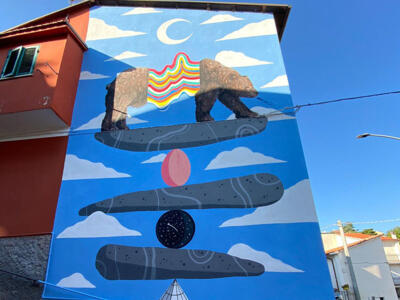She Needs Balance — Street art by Carlo Alberto Giardina in Aielli