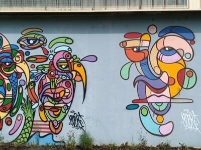 Visages emboîtés aux yeux multiples — Street art à Saint-Brieuc
