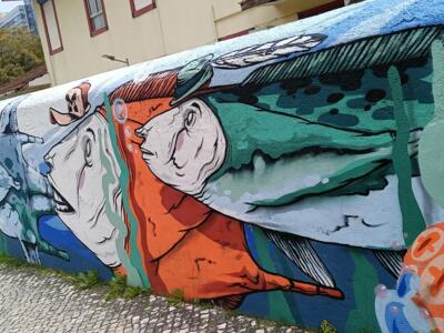 Hatted figures and fish — Street art by Mariana Rio in Lisboa