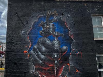 Hand Holding a Tattoo Machine — Street art by Hard Styler in London