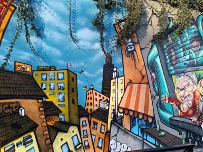 Cartoon city and turquoise window — Street art in Nantes