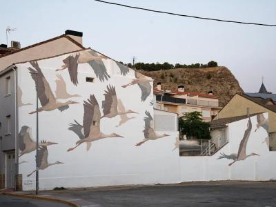 La loi de la cigogne — Street art de Taquen à Azagra