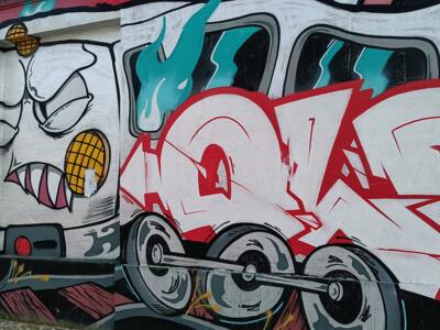 Grimacing Locomotive and Red Lettering — Street art by Colectivo RUA in Lisboa
