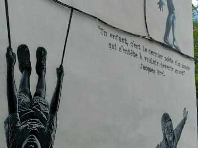 Child on a Swing by Jef Aérosol — Street art by Jef Aérosol in Bruxelles