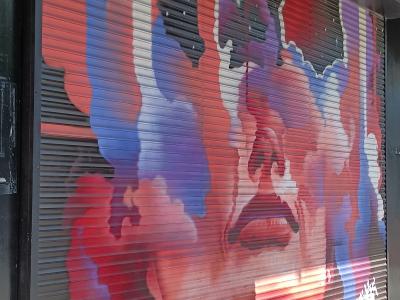 Face in the Red Clouds — Street art in Berlin
