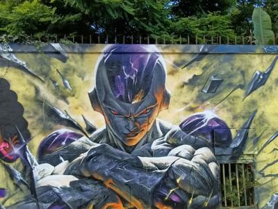 Freezer bras croisés sur mur jaune — Street art à Nantes