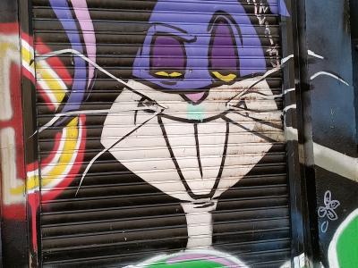 Purple Bugs Bunny on the Shutter — Street art in Berlin