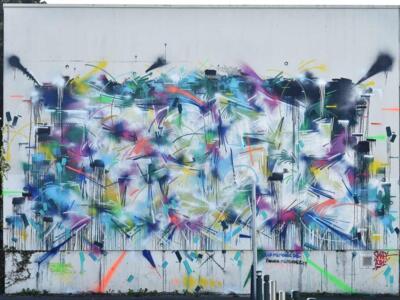 Burst of spray strokes — Street art by Rift in Caen