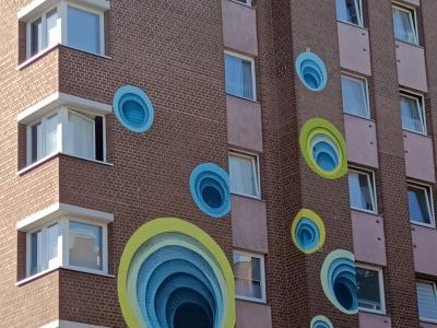 Hypnotic Circles on the Facade — Street art by 1010 in Berlin