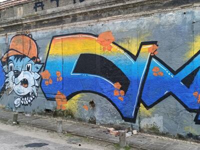 Blue Lettering and Cat in an Orange Beanie — Street art in Almada