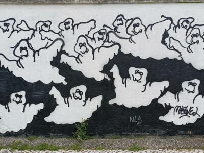Ghostly silhouettes on a black band — Street art in Lisboa