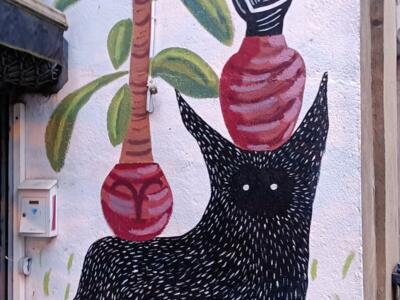 Black Dog and Pottery by Olivier Tenedor — Street art by Olivier Tenedor in Nantes