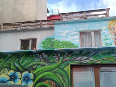The girl with the rabbit and the flowering forest — Street art in Köln