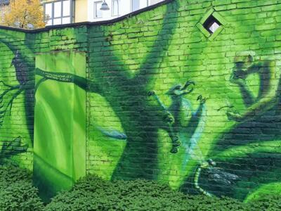 The bull in a red cloak and its jungle — Street art by Colorrevolution e.V. in Köln