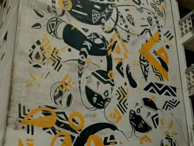 Composition tribale noire et jaune — Street art de Jhon Douglas à Lisboa