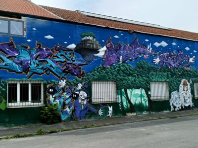 Ghibli Wall in Bétheny, Wide View — Street art in Bétheny