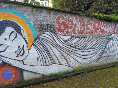 Reclining Buddha by Rakaposhii — Street art by Captain Borderline, Rakaposhii in Köln