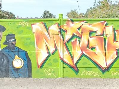 Public Enemy and Orange Lettering — Street art in Reims