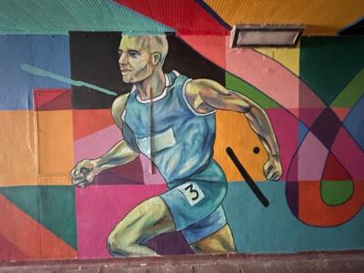 running athlete — Street art by Heol Art in Dinard