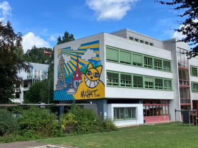 The Yellow Cat of Le Locle — Street art by M. Chat in Le Locle