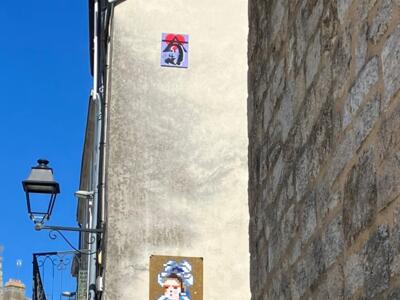 Breton woman in a lace headdress — Street art by A2 in Vannes