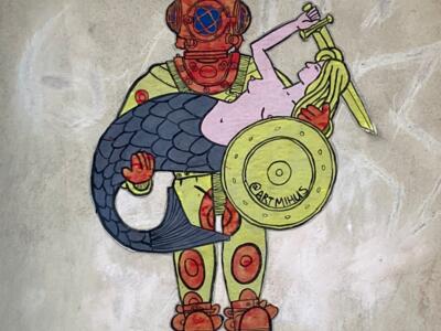 Diver with a mermaid — Street art by Mihas Mishuk in Warsaw